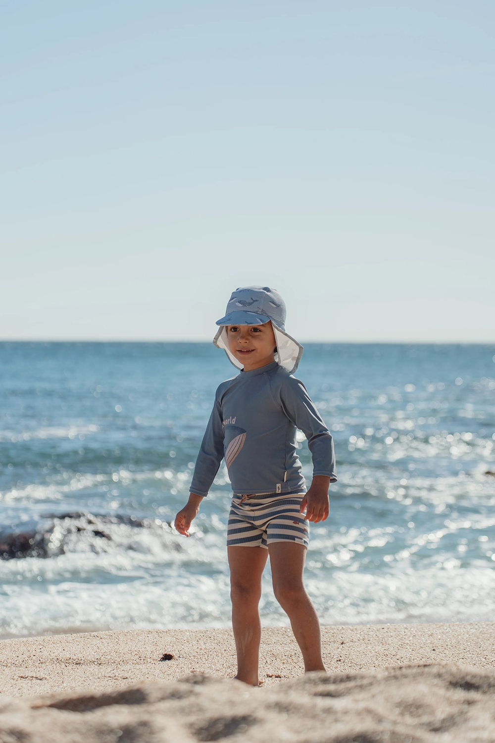 Sonnenhut mit Nackenschutz - Ocean Splash blau (Gr. 0-12 Monate)